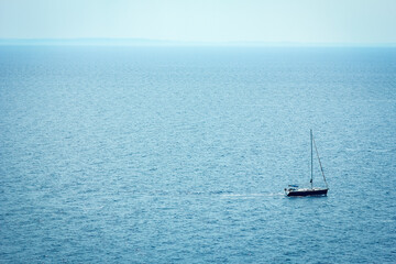 A beautiful yacht sailing in the sea silhouette background