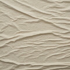 Crumpled beige paper background texture showing folded details