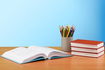 Classroom setting: school supplies placed on desk.