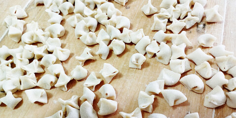 Meaty manti. Traditional Turkish food manti made on wood. 
