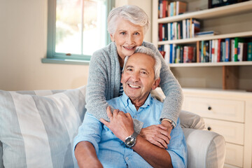 Hug, love and portrait of senior couple on sofa for connection, bonding and relaxing together at home. Smile, happy and elderly man and woman embracing, marriage and resting at house in Canada.