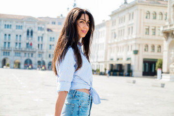 Beautiful smiling  woman on the street in Italy 