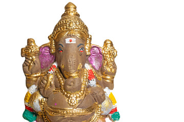 Fototapeta premium Ganesha idol made of painted clay on white background.