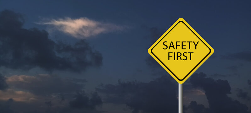 Safety first symbols, work safety, caution work hazards, danger surveillance, zero accident concept. Wooden cubes with smart grey background. Employees safety awareness at workplace. Safety banner.