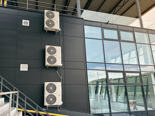 Rooftop HVAC system on industrial building exterior with metal structure