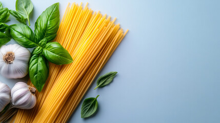 Creative arrangement of raw noodles, garlic, and herbs on blue background for National Noodle Day. Banner, copy space