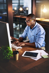 African, businessman and typing on tech at night in research as corporate communication specialist. Male person, working late and desktop for connection, internet or company as professional in office