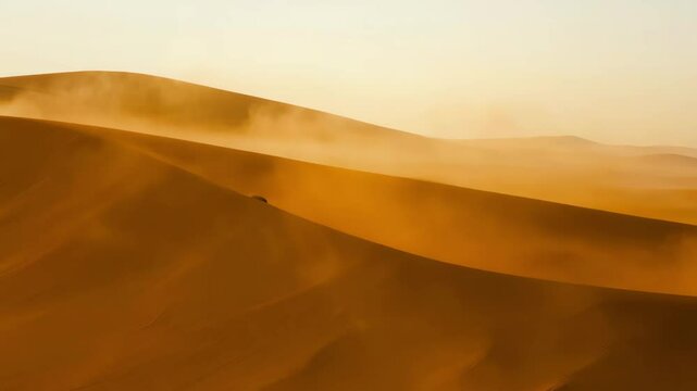 Sandstorm blowing over desert dunes creating shapes