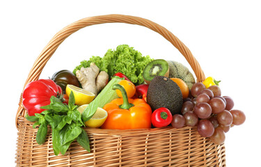 Many different fruits and vegetables in wicker basket isolated on white