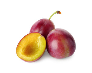 Whole and cut ripe plums isolated on white
