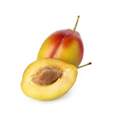 Whole and cut ripe plums isolated on white
