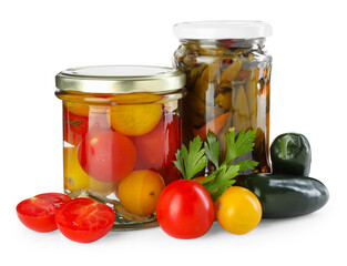 Tasty pickled vegetables in jars and fresh ingredients isolated on white