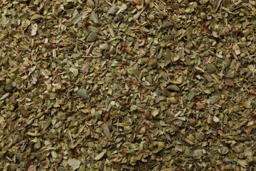 Dried oregano as background, top view. Aromatic herb