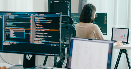 Group Adult Asia male, female freelance typing write prompt AI bot IT app smart program nomad, video game, terminal with coding language, user interface, designer, big data center on desktop computer.