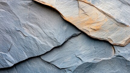  A detailed view of a rocky cliff featuring a bird atop one of its larger boulders