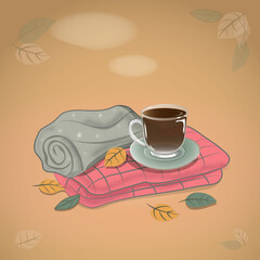 A vector illustration of a cozy autumn with a glass cup of hot tea on two folded blankets and autumn leaves around.
