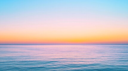 Obraz premium Serene Pastel Hued Sunrise Over Tranquil Ocean Horizon