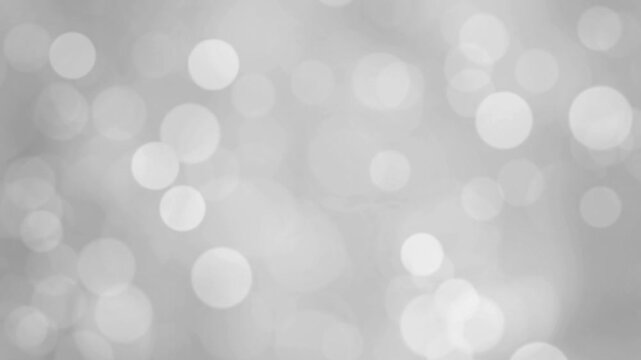 Abstract white bokeh stock motion background.