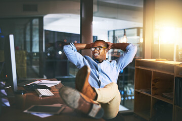 Portrait, business and black man rest in office with computer, project done and success for proposal. Male person, relax and documents at night with task achievement, deadline solution and overtime