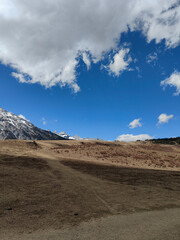 Panoramic view of snowy mountains in a mountain range isolated over white