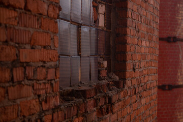 a window in an old brick wall