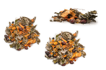 Dry tea leaves and dry fruit isolated on white background.
