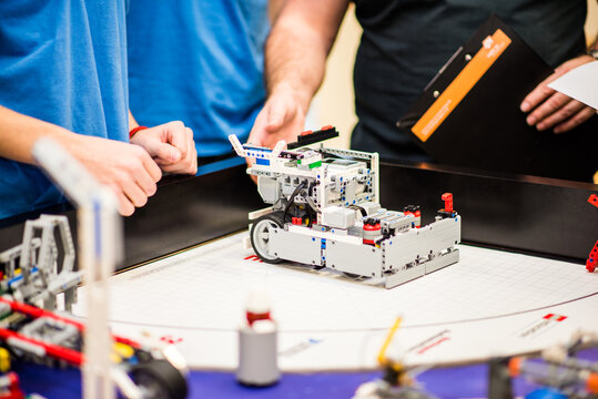 Zilina, Slovakia- dec 14. 2018: First Lego league FLL robots and objects from LEGO on the game table Space theme parts, characters, functional robots created by  competing childrens to solve problems