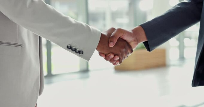 Closeup, handshake and men in office, agreement and partnership for company merger. Shaking hands, professional and employees with thank you in meeting, crm and contract with b2b deal and welcome