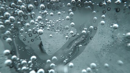 Macrography, witness the mesmerizing allure of a margarita bubble delicately adorned with a slice of lime, set against a bold black background. Each close-up shot of cocktail with lime. Comestible.