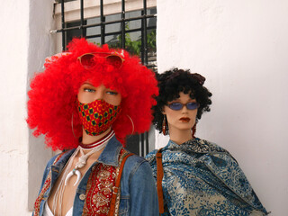 Detail of a shopfront with manikins and wig