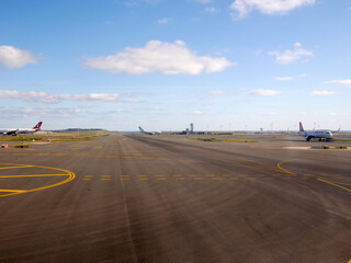 Airport runway after landing. Blue sky