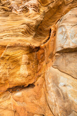 Full frame of sandstone cliff drawing, rock formation, natural sandstone on beach in california, lines and curves of stone used for background