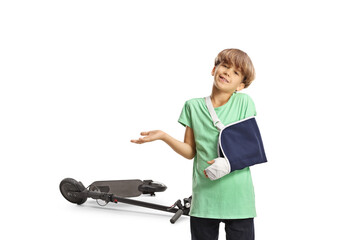 Boy with a broken arm wearing an arm splint, electric scooter injury concept