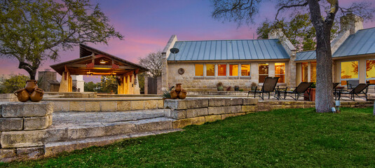Elegant evening view of a rustic retreat surrounded by nature and twilight sky