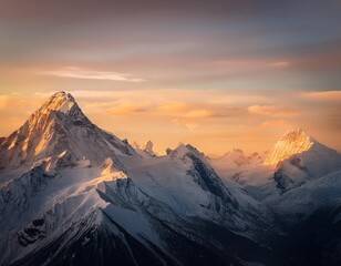 Serene snow-capped peaks at sunrise with golden light touching the mountain tops