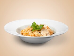 Tasty fresh macaroni pasta with sauce and basil leaves