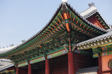Gyeongbokgung Palace, Seoul, Jongno District, South Korea, in a spring sunny day, exterior view of main Korean royal palace in Cherry Blossom season, with Bugaksan mountain in the background