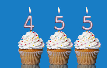 Birthday Cupcakes With Candles Lit Forming The Number 455