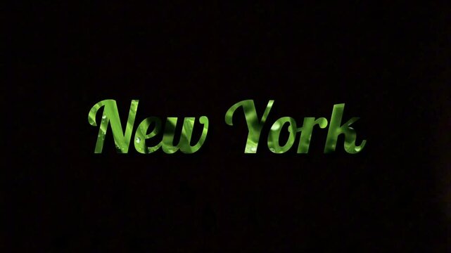 New York City writing with a green pattern and black background