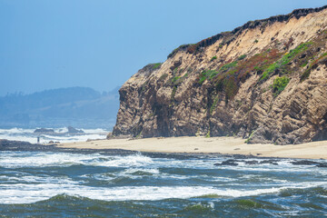 Cowell Ranch beach with ocean waves near Half Moon Bay on the California coast. Beautiful scenery, concept of rest, vacation, tourism