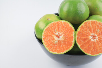Fresh orange fruit with sliced on white background. Fresh summer fruit high vitamin C. Refresh drink.