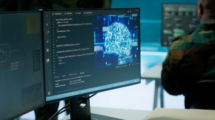 Cybersecurity expert oversees intelligence gathering through AI brain visualization and neural...