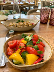 Colorful Tomato and Bell Pepper Salad on a Wooden Table