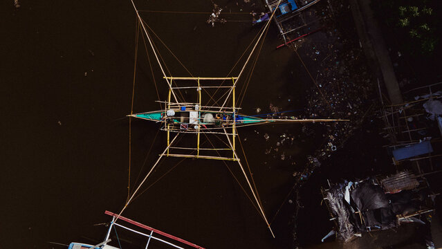 Boats and fishermen at the maragondon river cavite