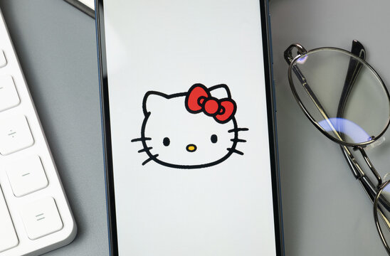 New York, USA - 30 August 2024: Hello Kitty Logo on Phone Screen, Company Icon on Display