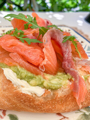 Gourmet Avocado and Salmon Toast with Fresh Arugula