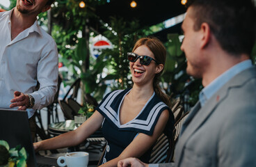 Group of businesspeople enjoying a vibrant meeting at an outdoor cafe, sharing laughter and ideas...