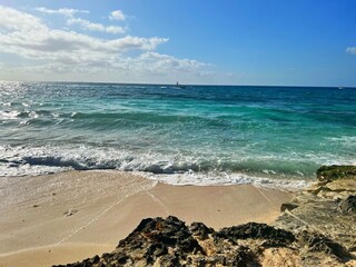 beach and sea with waves breaking 