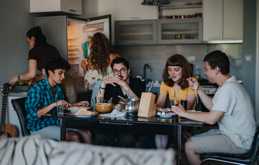 A diverse group of friends share a casual meal in a cozy kitchen, emphasizing friendship and togetherness in a modern home environment.