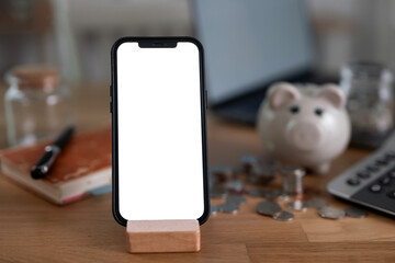 Mockup blank white screen mobile phone on wooden table, business, finance, investment, saving and...